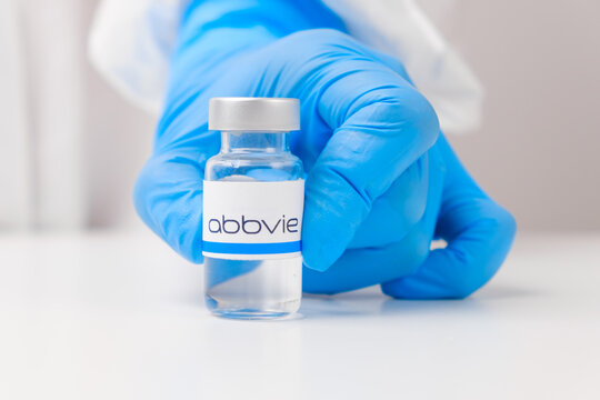 Abbvie vial or bottle with pharmaceuticals demonstrated by health worker or scientist in rubber gloves, April 2021, San Francisco, USA 