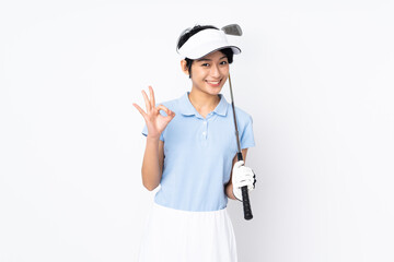 Young Vietnamese golfer woman over isolated white wall playing golf making OK sign
