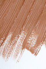 Beige smear of tonal foundation texture cream wallpaper. Cosmetic products for makeup and skin care concept