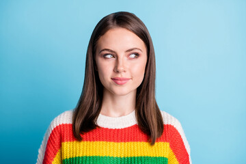 Photo of shiny tricky young lady wear striped outfit looking empty space isolated blue color...
