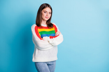 Photo of nice optimistic brunette lady crossed arms wear colorful sweater isolated on blue color background