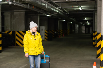 Middle-aged woman at car parking lot.