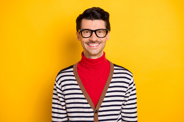 Fototapeta premium Photo of young handsome man happy positive smile wear eyeglasses red turtleneck isolated over yellow color background