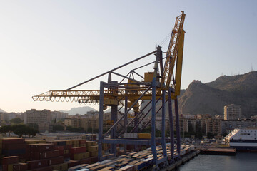 Fototapeta na wymiar Palermo shipyard in Italy, ships in storage and cranes in the shipyard