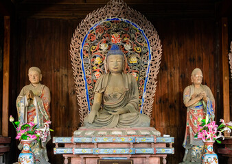 Statues of Buddha and two disciples at Zijin Temple in Dongshan town, Suzhou, Jiangsu, China, famous for Arhat sculpture made by Lei Chao and his wife in Southern Song Dynasty. Heritage.