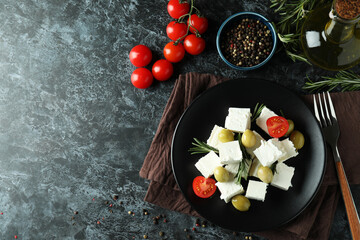 Concept of tasty food with feta cheese on black smokey background