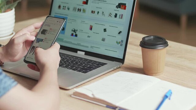 Man Use Mobile Phone And Laptop Computer Shopping Online
