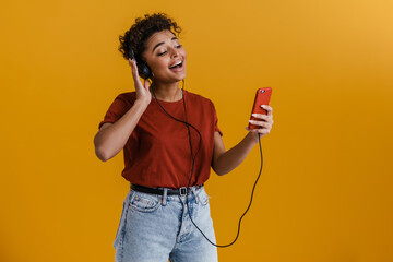 Happy casually dressed young african woman