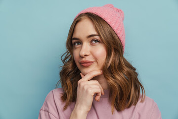 Young white woman thinking and touching her chin