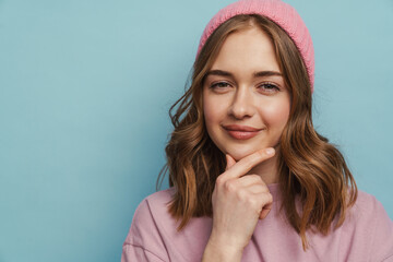 Young white woman thinking and touching her chin