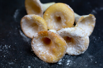 Close up pastry biscuits cookies in sugar powder, weird shaped food