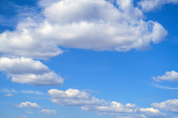 Naklejka na ściany i meble Clouds lined up in a circle in the blue sky, copy space for text