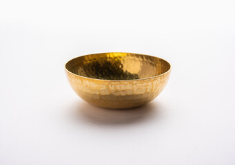 empty crockery - New brass or gold bowl over white background