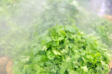 Food background of fresh green leaves in a store close up