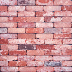 Retro red brick wall. Vintage wall made of bricks of different shades