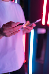 Buying in cyberspace. Close-up phone and bank card