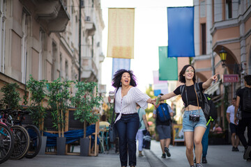 Fototapeta premium Two tourist women on street.