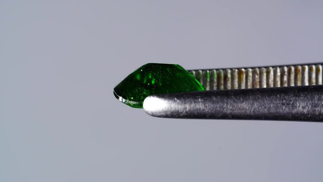 natural chrome diopside in the tweezer on the turn table