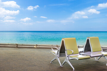 Airport chair at waiting area with beautiful beach view, holiday destination, summer vacation