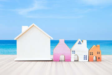 Wooden house model collections over beach background, summer house, beach house, outdoor day light