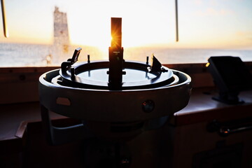 View of the sunset from the ships construction and navigational bridge. © masterskuz55