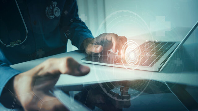 Medical doctor with technology service diagnose checking virus testing system with VR screen, using laptop and tablet.