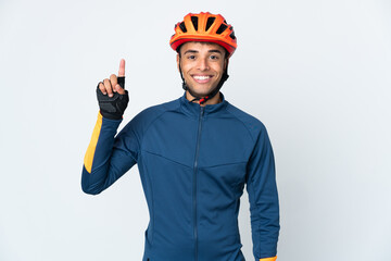 Young cyclist Brazilian man isolated on white background pointing up a great idea