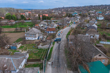 Due to the accident, a lamp post fell on the minibus. Severe car accident. Drone photography