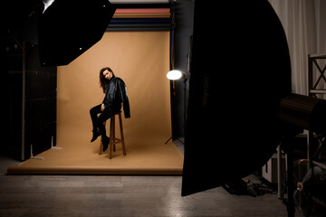 portrait of a woman with long hair sitting on a chair