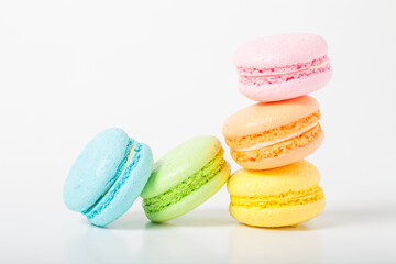 Colorful cake macaroons on a light background