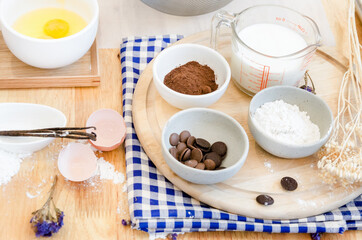 Top View Baking Preparation on wooden Table,Baking ingredients. Bowl, eggs and flour, rolling pin and eggshells on wooden board,Baking concept