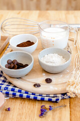Top View Baking Preparation on wooden Table,Baking ingredients. Bowl, eggs and flour, rolling pin and eggshells on wooden board,Baking concept