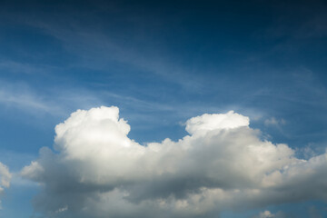 Dramatic white clouds and dark blue sky