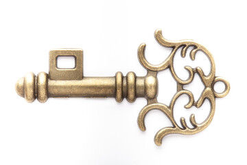 Decorative metal key on the empty white background