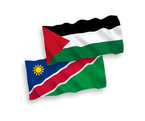 National vector fabric wave flags of Republic of Namibia and Palestine isolated on white background. 1 to 2 proportion.