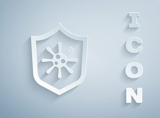 Paper cut Shield protecting from virus, germs and bacteria icon isolated on grey background. Immune system concept. Corona virus 2019-nCoV. Paper art style. Vector
