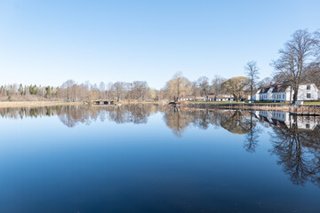 Calm lake reflection in spring. Farnebofjarden national park in north of Sweden.