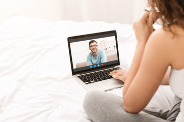 Fototapeta premium Remote Communication. Unrecognizable Lady Making Video Call On Laptop To Her Boyfriend