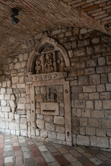 Stone relief of the 15th century prepare us to the old town of Kotor, Montenegro.
