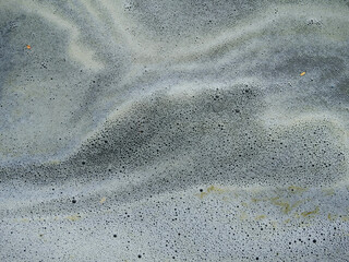 Obraz premium dirty foam on sewage in the pond