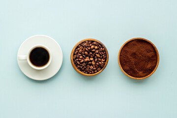 Top view of diffetent varieties of coffee beans with hot drink, top view