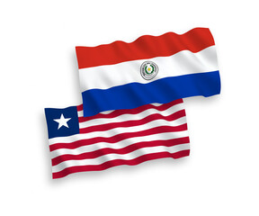National vector fabric wave flags of Paraguay and Liberia isolated on white background. 1 to 2 proportion.