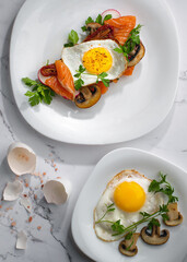 Egg Sandwiches and fried eggs for healthy breakfast on white table.