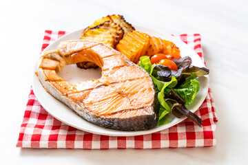 grilled salmon steak fillet with vegetable and french fries