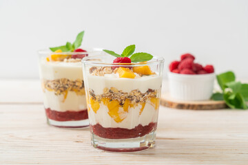 homemade mango and raspberry with yogurt and granola