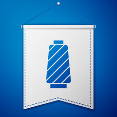Blue Sewing thread on spool icon isolated on blue background. Yarn spool. Thread bobbin. White pennant template. Vector