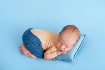 Lovely newborn resting on pillow. sleeping newborn baby boy