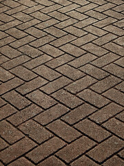 old zigzag stone block floor of walkway texture