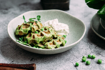 Zucchini waffles with cream cheese. Vegetarian green waffles