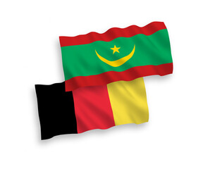 National vector fabric wave flags of Islamic Republic of Mauritania and Belgium isolated on white background. 1 to 2 proportion.
